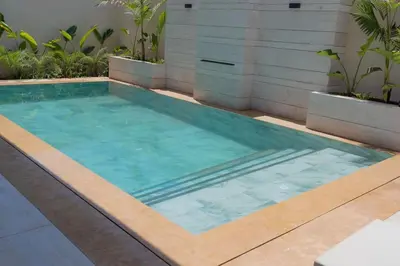 a swimming pool in the middle of a building at Villa Volubilis - Marrakech in Marrakech