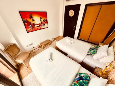 a living room with two couches and a couch at Maison d'Hôte Angele in Sfiani