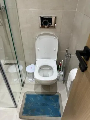 a small bathroom with a toilet in a stall at Gorgeous newly renovated apt- Near Restaurant and Shopping Center in Marrakech