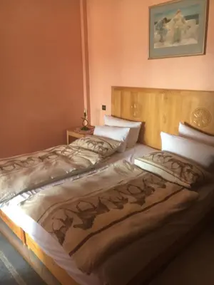 two beds sitting next to each other in a bedroom at Appartement Elias Marrakech in Marrakech