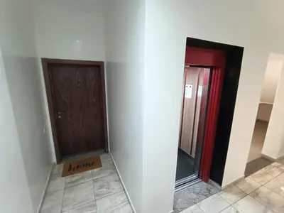 a hallway with two doors and a sign that reads karma at Oasis Appart in Marrakech