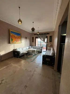 a large living room with couches and a table at Appart 2ch Marrakech in Sraghna