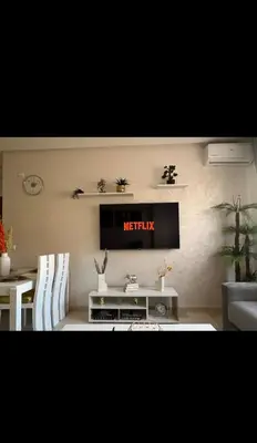 a living room with a television on the wall at Stylish Appartement in Marrakech in Marrakech