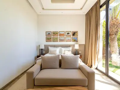a living room with a couch in front of a window at Palais Noor in Douar Caïd Layadi