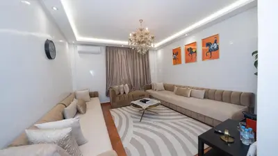 a living room with a couch and a table at Appartement à Marrakech in Marrakech