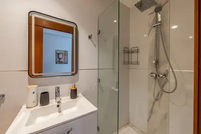 a bathroom with a sink and a shower at Luxury Apartment in Marrakech in Marrakech