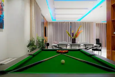 a pool table in a room with a pool ball at Villa de luxe Avec piscine à Argan Golf Resort in Marrakech