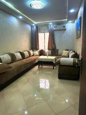 a living room with a couch and a table at Dar yahya in Marrakech