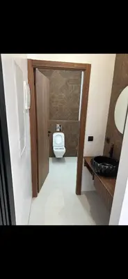 a bathroom with a toilet and a sink at Luxe villa in marrakech in El Makina