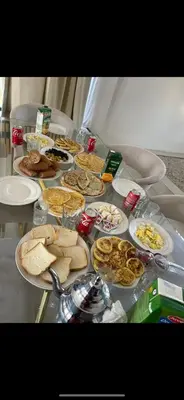 a table with a bunch of food on it at Luxe villa in marrakech in El Makina