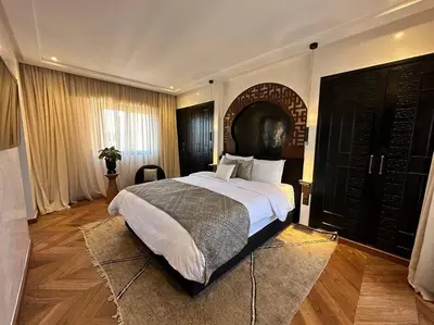a bedroom with a large bed in a room at Roof top terrasse Centre-Gueliz JACUZZI in Marrakech