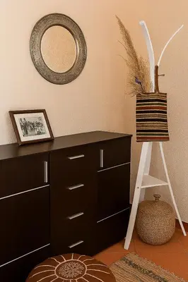 a room with a dresser and a mirror on the wall at Dar Diego des appartements au Centre de la Médina in Marrakech