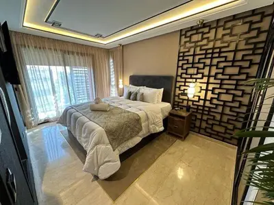 a bedroom with a bed and a large window at Ultra-Luxury 2-Bedroom Apartment in City Center Atlas View in Marrakech