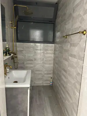 a bathroom with a sink and a shower at Appart à Marrakech,spacieux, calme et propre in Marrakech