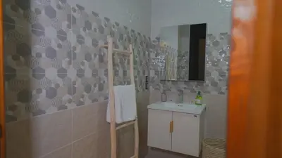 a bathroom with a sink and a mirror at Modern Apartment in Centre of Marrakech For Friends & Families in Marrakech