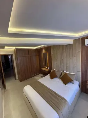 a bedroom with a large bed in a room at Bel Appartement Hivernage Gueliz in Marrakech
