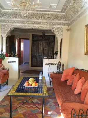 a living room with a couch and a table at Zina in Marrakech