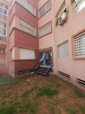 an outside view of a pink building with a porch at Apparemment chic in Marrakech