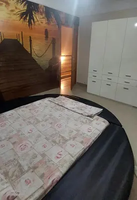 a bedroom with a bed with money on it at دوبلكس في مراكش in Marrakech