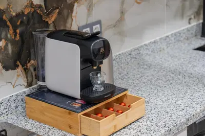 a coffee maker sitting on top of a counter at Luxueux appartement -70 haut gamme Guéliz in Marrakech
