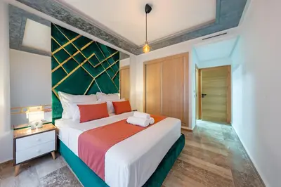 a bedroom with a large bed in a room at Apprtement -74-de luxe haut gamme guéliz in Marrakech