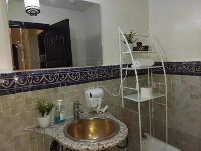 a bathroom with a sink and a mirror at Atlas Golf resort in Marrakech