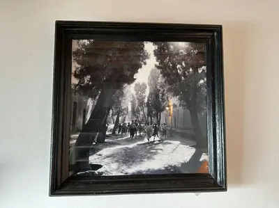 a picture of a painting of people walking down a street at Dar Hatim in Marrakech