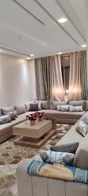 a large living room with couches and a table at مراكش تاركة in Marrakech