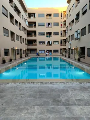 a large swimming pool in the middle of a building at Nour5 in Marrakech
