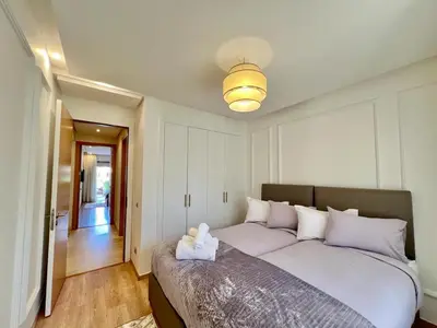 a bedroom with a bed with a stuffed animal on it at Prestigia Apart 29 in Marrakech
