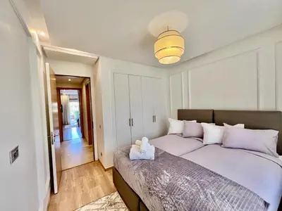 a bedroom with a large bed in a room at Prestigia Apart 29 in Marrakech