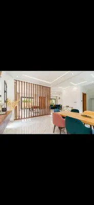 a dining room with a table and chairs and a room at Beautiful villa Argan golf in El Makina