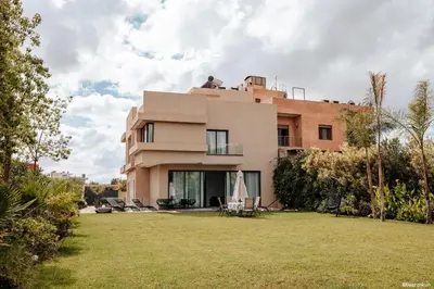 a house with a lawn in front of it at Beautiful villa Argan golf in El Makina