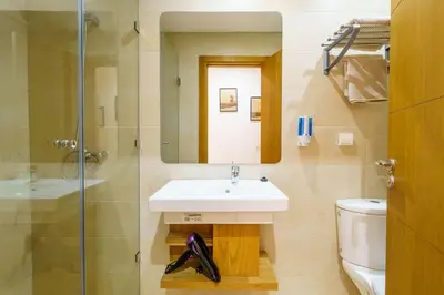 a bathroom with a sink and a shower and a toilet at Luxury Appartement Cosy 2BR City center Secure Parking Wifi in Marrakech