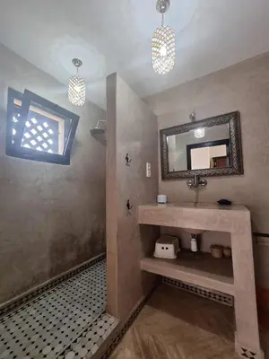 a bathroom with a sink and a mirror at Atlas Golf resort in Sfiani