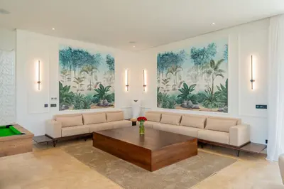 a living room with a couch and a table at Villa Piscine, Salle de Sport et Confort Moderne in Marrakech