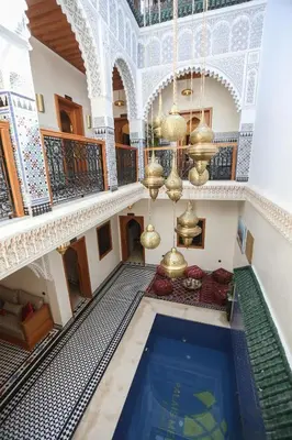 an overhead view of a building with a swimming pool at Riad Palais MERYEM in Marrakech