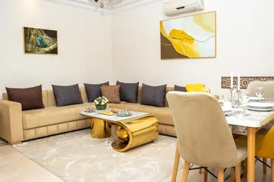 a living room with a couch and a table at Boho Haven Hivernage - Plein centre ville in Marrakech