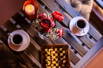 a table with two cups of coffee and flowers on it at Boho Haven Hivernage - Plein centre ville in Marrakech