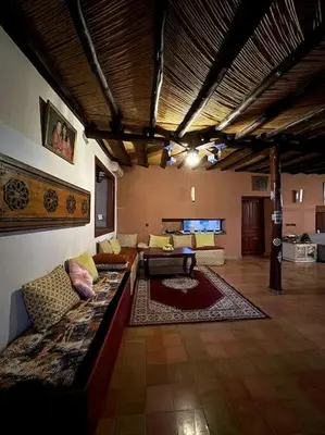 a living room with a large couch in a room at 2 Habitaciones en magnifico riad in Marrakech
