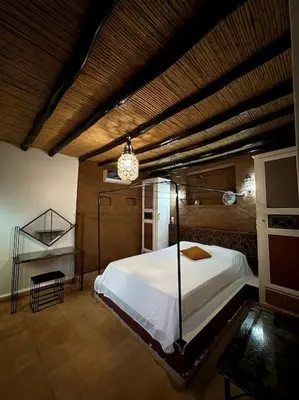 a bedroom with a large bed in a room at 2 Habitaciones en magnifico riad in Marrakech