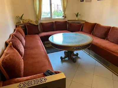 a living room with a couch and a table at TerHouse in Marrakech
