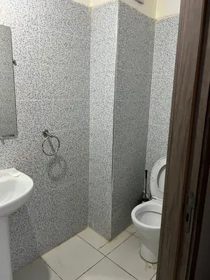 a bathroom with a toilet and a sink at TerHouse in Marrakech