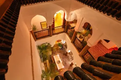an overhead view of a building with a spiral staircase at Riad Banafsaj - Exclusif - 20mn de Jamaa Al Fnaa in Marrakech