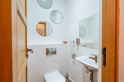 a bathroom with a sink and mirrors on the wall at Riad SWAN-exclusif - Piscine chauffée - Petit déjeuner in Marrakech