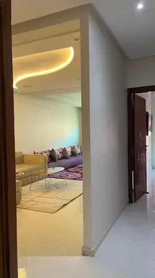 a living room with a couch and a table at Appartement de luxe en plein centre à Marrakech in Marrakech