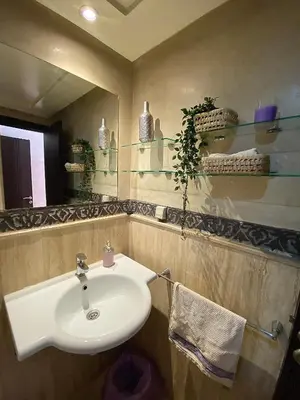 a bathroom with a sink and a mirror at Appartement 2 Chambre au Coeur de gueliz Marrakech in Marrakech