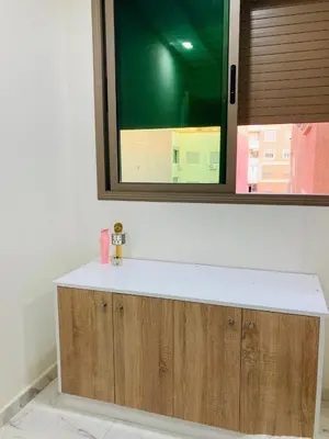 a bathroom with a sink and a mirror at Magnifique appartement à Marrakech in Marrakech