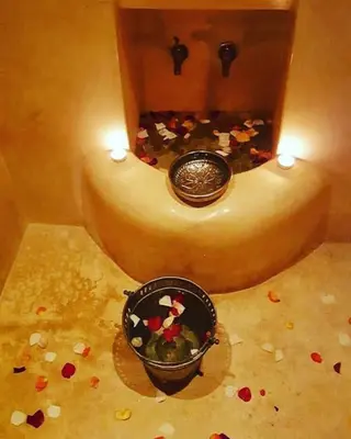 a room with a bowl of flowers on the floor at Riad Dar Colline in Marrakech