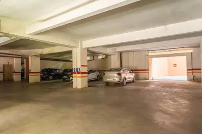 an empty parking garage with cars parked in it at Oasis exclusive avec piscine dans le centre-ville in Marrakech